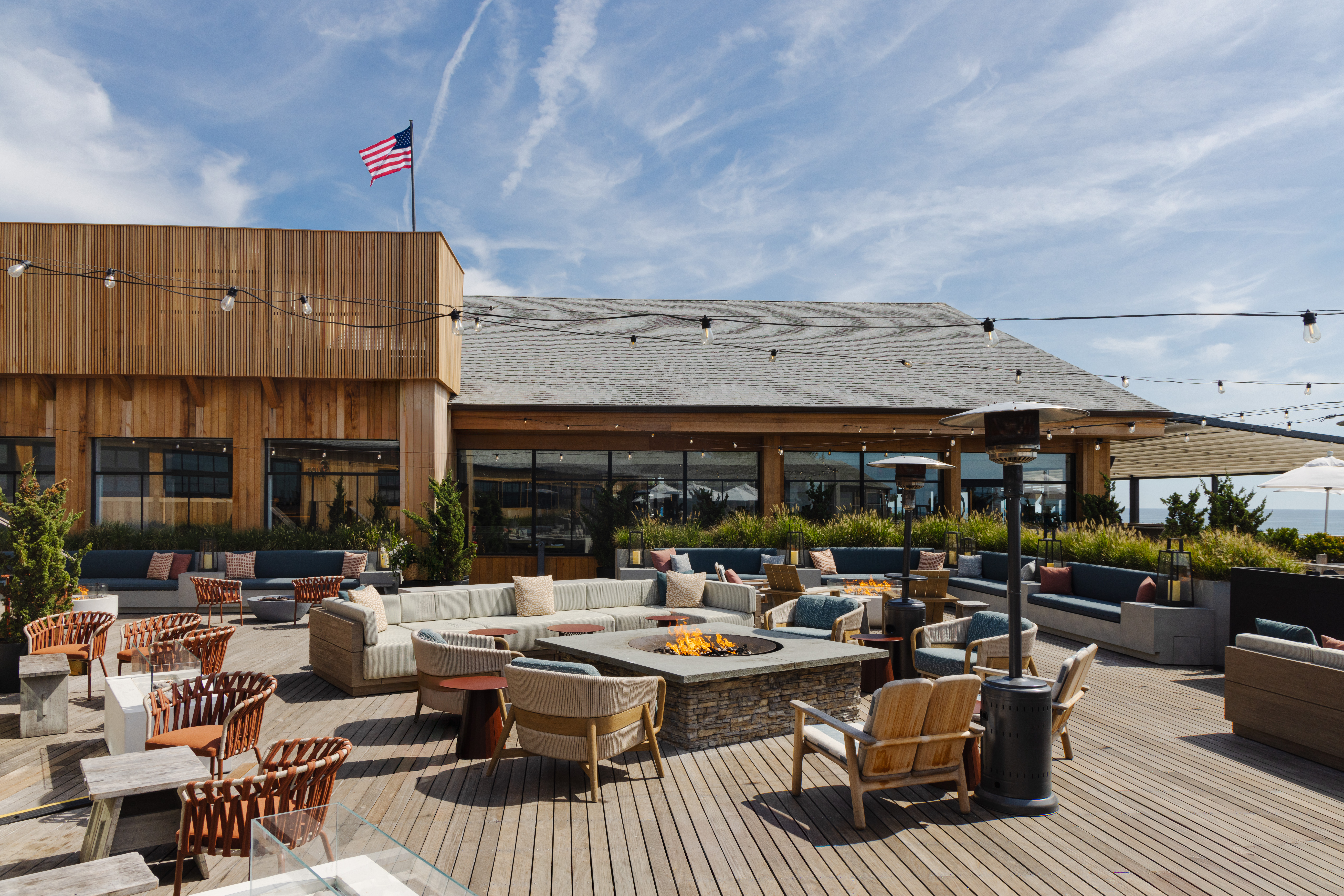 outdoor seating with tables chairs and fire pit