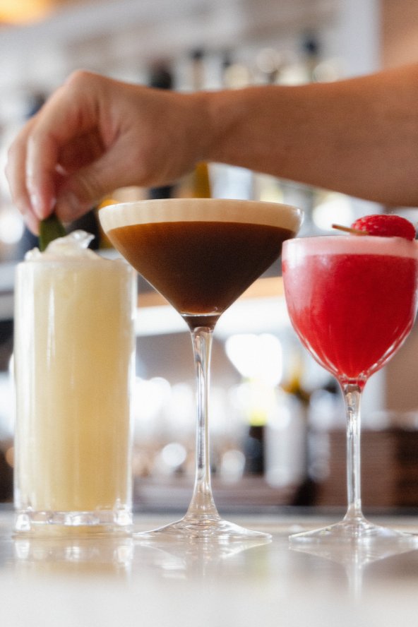 Various cocktails being garnished