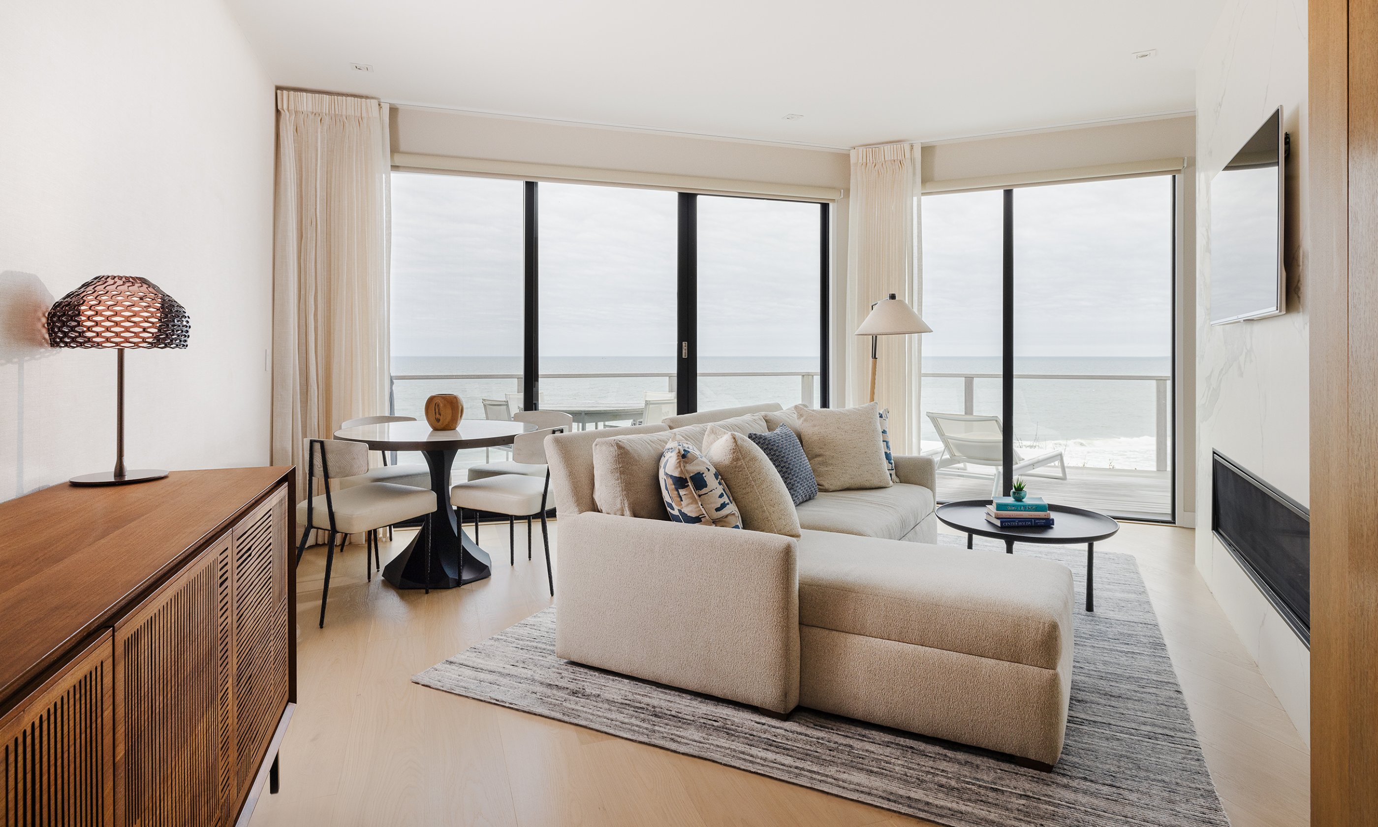 The living area in the Ocean View One Bedroom Residence at Gurney's Montauk Resort