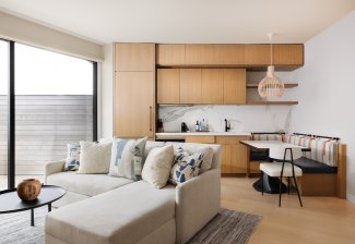 The living area and kitchen in the Ocean View Two Bedroom Residence at Gurney's Montauk Resort