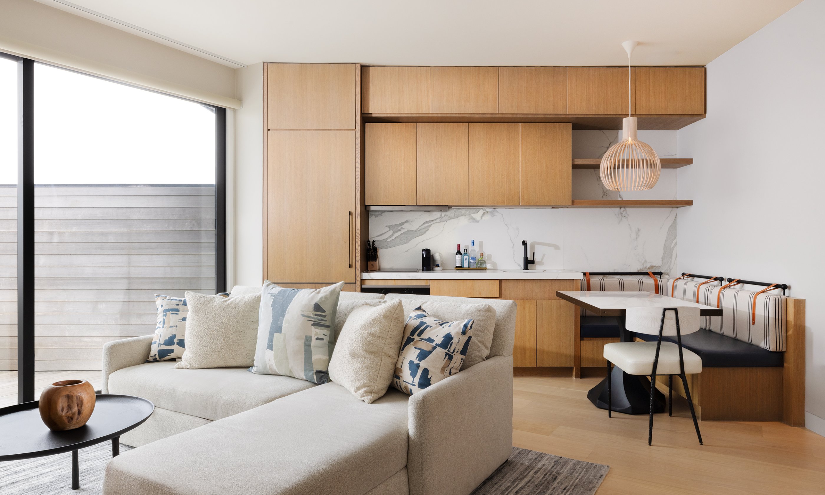 The living area and kitchen in the Ocean View Two Bedroom Residence at Gurney's Montauk Resort