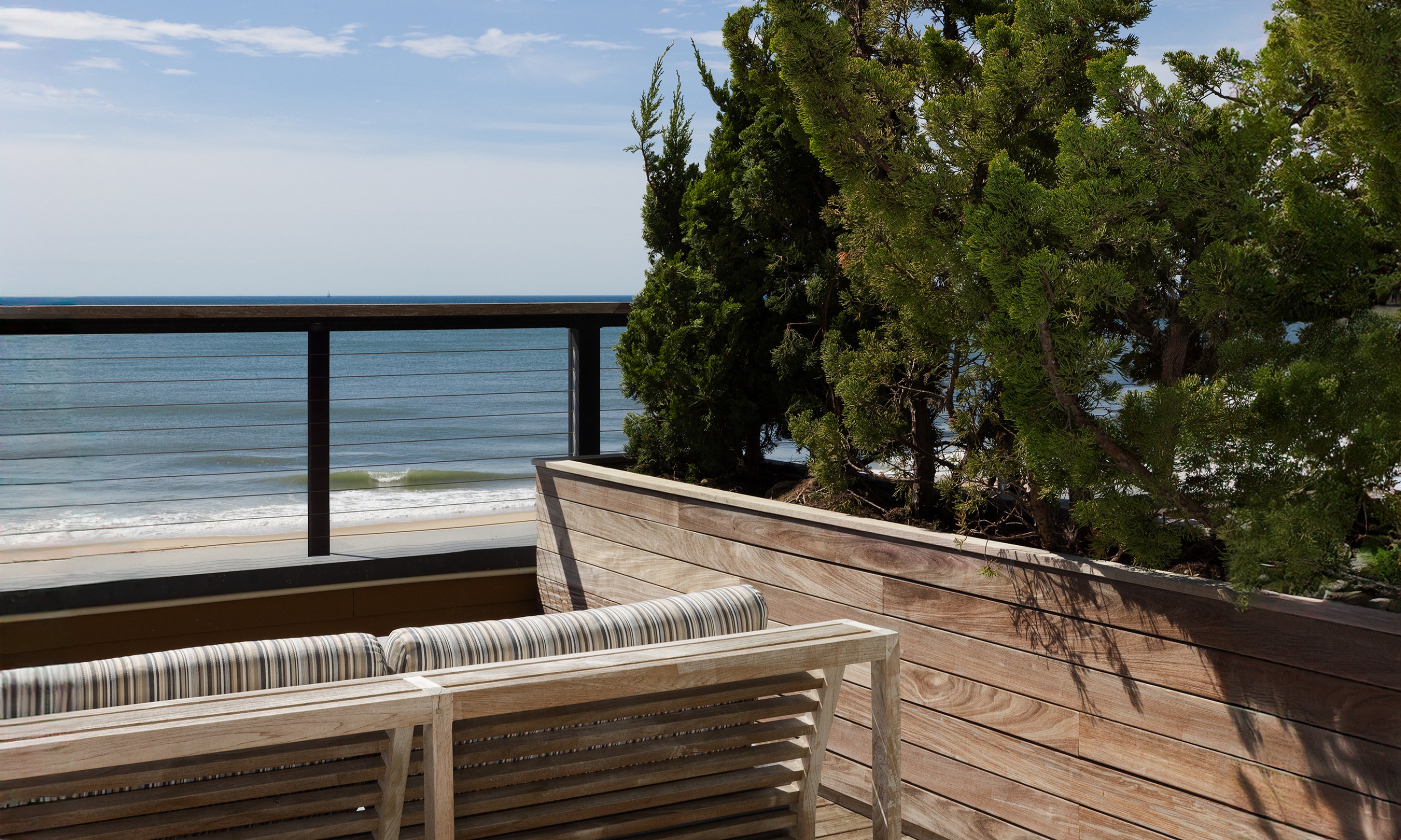 The patio in an Oceanfront Two Queen Room at Gurney's Montauk Resort